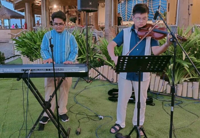 Loboc Children's Choir pianist Kenshin Cal and Manila-based guest violinist George Bernard Supetran